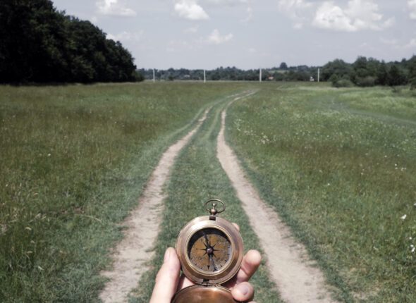 Man with compass in hand
